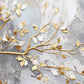 Fototapete mit 3D-Effekt in Weiß und Gold für Zuhause „Goldener Zweig“